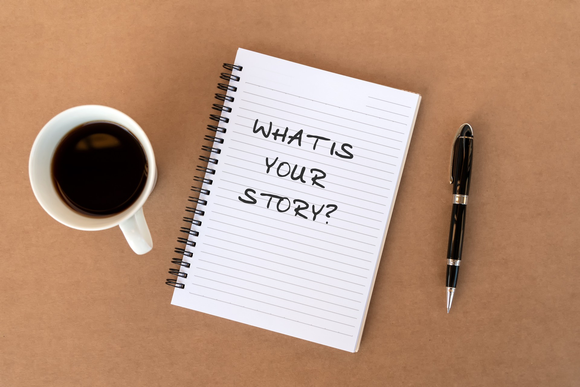 What is your story? text on note pad